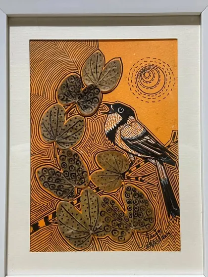 This framed artwork by Puja Kumari, which has now been sold, shows a bird singing under the sun. The use of real leaves and intricate line work makes her art both unique and highly sought after by collectors.