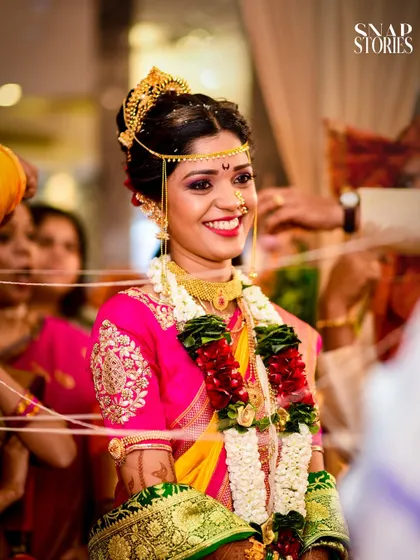 The bride's radiant smile during the wedding ceremony. Our candid shots focus on capturing the pure joy and happiness of the moment.