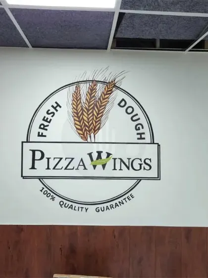 The main logo wall for Pizzawing in Panipat, featuring their brand name and a "Fresh Dough" emblem. We specialize in creating clean, professional logo murals that make a strong first impression.