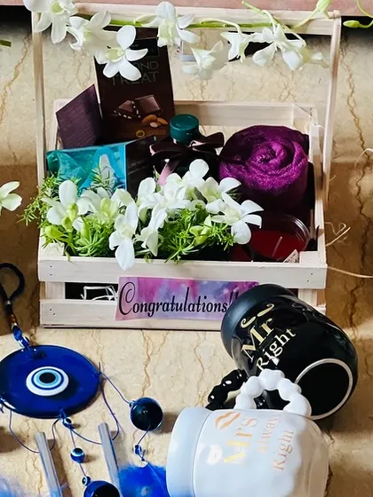 A wide shot of three corporate wedding hampers, demonstrating my ability to create consistent, high-quality gifts in multiples.