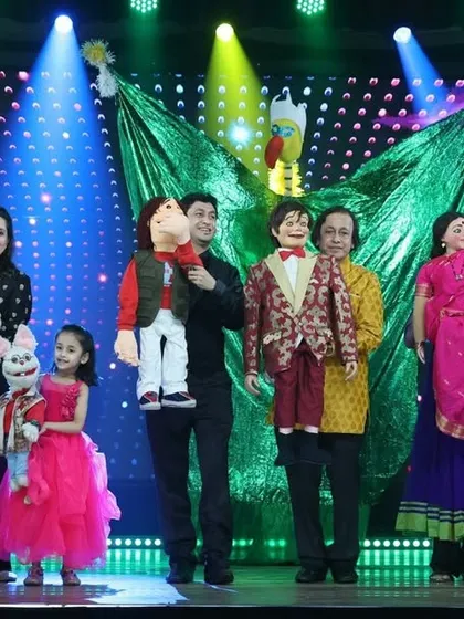 The full cast and puppet family on stage for the final bow. A moment of immense pride and gratitude.