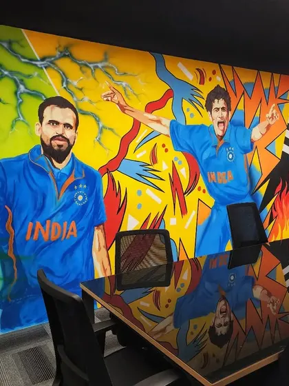 Another angle inside the conference room, showing the dynamic energy of the artwork.