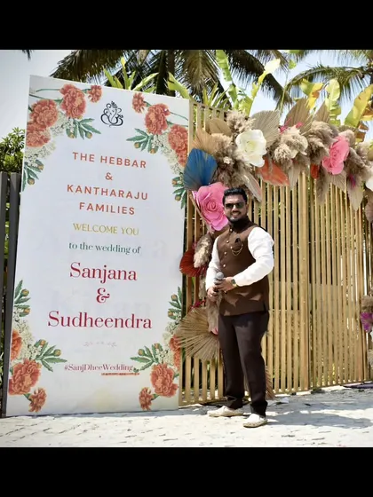 A full-length shot at the entrance of a Haldi ceremony, ready to welcome guests to a day of fun.