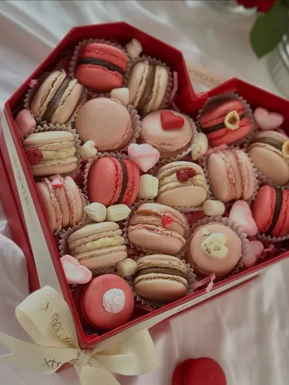 Our heart-shaped macaron box is a showstopper for Valentine's Day. It's filled with an assortment of delicate, handcrafted macarons in romantic hues.