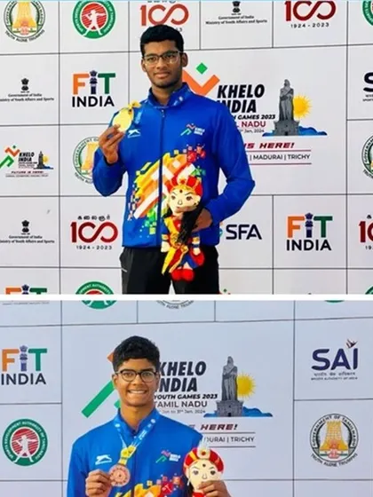Nithik and Akash dominating the 200m backstroke podium.