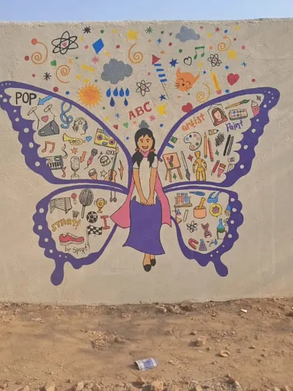 A butterfly girl mural with wings full of doodles representing different arts and sports, encouraging students to explore their passions.