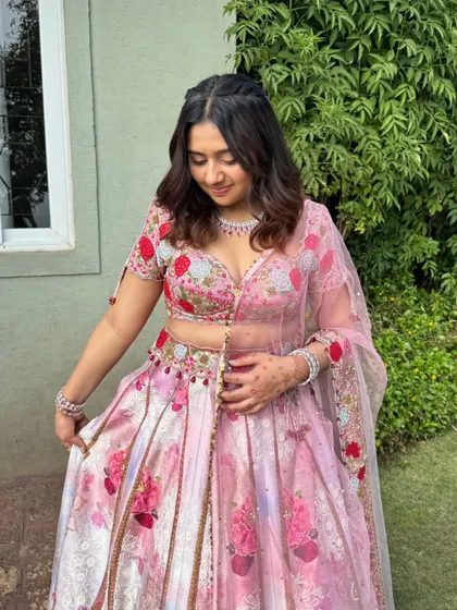 The bridesmaid looks effortlessly beautiful. The makeup enhances her features without being overpowering.
