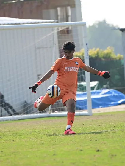 Our goalkeeper in action during the Dream Sports Championship, showcasing his confidence and technique as he prepares to distribute the ball.