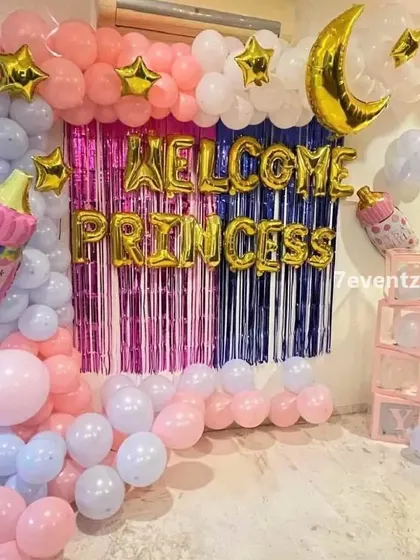 A 'Welcome Princess' home decoration with a pink and purple theme, a shimmer curtain, and moon and star foil balloons.