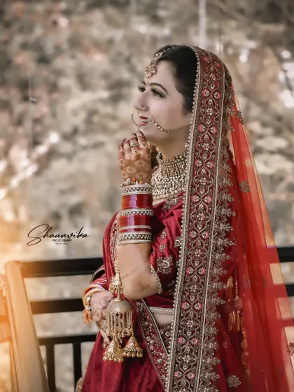 A thoughtful pose by the bride, looking out into the distance. This portrait captures the emotion and anticipation of the wedding day.