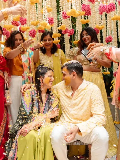 A fusion of cultures. For this North Indian couple who fell in love in Pondicherry, we designed a Haldi and Mehendi evening that blended traditional South Indian elements like banana leaves and brass lamps with vibrant floral decor.