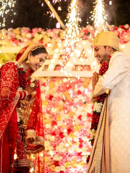 The Varmala exchange, with fireworks adding to the spectacle. We are experienced in capturing these fast-paced, high-energy moments with perfect timing.