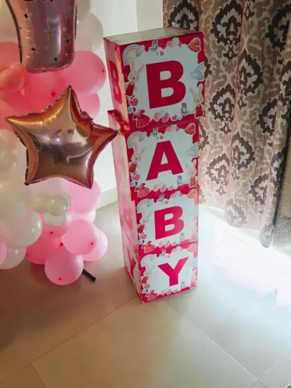 It's all in the details. These custom "BABY" blocks in a pretty pink design add a lovely, personalized touch to a baby girl's welcome home or baby shower decoration.