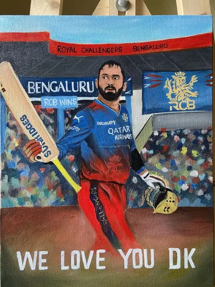 The full DK painting on an easel, with the stadium and fans in the background.