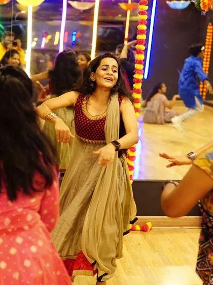 A candid moment of pure joy during a group Garba practice. Our goal is to make sure everyone is having a great time while learning the choreography.