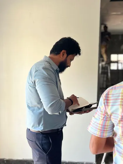 A photo of me on-site, reviewing plans and ensuring every detail aligns with the project vision.