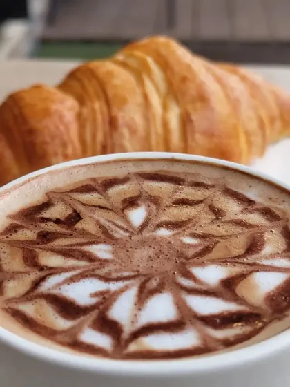 The perfect pairing: a warm, flaky croissant and a hot, expertly made coffee. It’s a simple pleasure that I love to share with my guests every day.