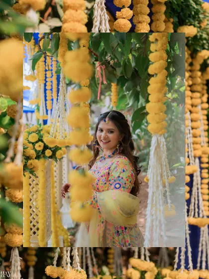 A lovely portrait of the bride framed by hanging marigold garlands.