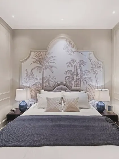 A symmetrical, wide shot of the monochrome bedroom, showcasing the statement wallpaper and the balanced arrangement of lamps and pillows. The image conveys a sense of harmony, style, and calm.