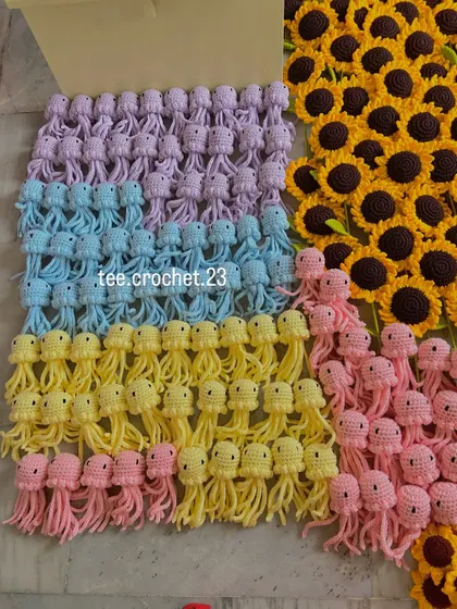 Rows of my pastel amigurumi jellyfish, a popular item for shop decor. This photo shows the consistent quality and cute design you can expect in a bulk order of my crochet characters.