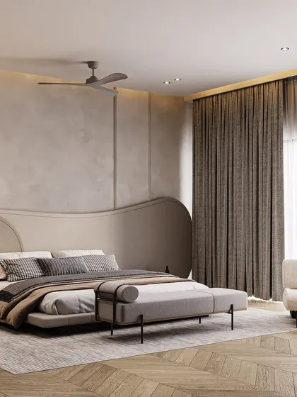 Another angle of the opulent master suite, showing how the sculptural headboard, ethereal pendant lights, and layered drapery work together to create a space that feels both grand and incredibly calming.