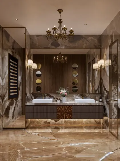 A bathroom concept that exudes classic luxury, with warm-toned marble floors and walls, a double vanity, and ornate wall sconces. The design feels both opulent and timeless.