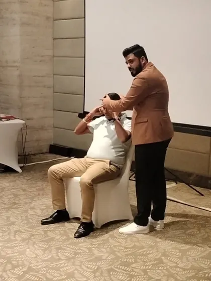 A demonstration of hypnotic touch during my show for HSBC's premium customers.