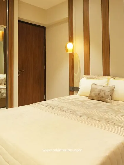 This bedroom features a space-saving design with a mirrored sliding wardrobe. The mirror not only adds functionality but also makes the room feel larger and brighter.