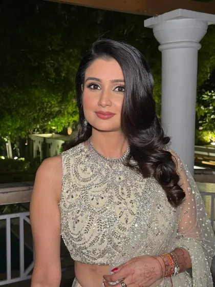 A close-up of this glamorous reception makeup. The soft smokey eye and radiant skin create a look that is both sophisticated and beautiful.