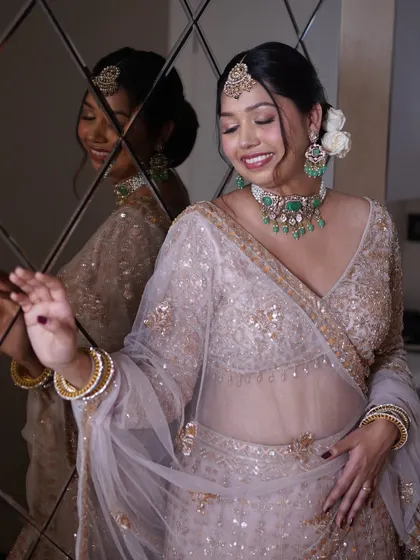 Shining brighter than jewels. This bride's reflection captures her happiness and the flawless finish of her makeup.