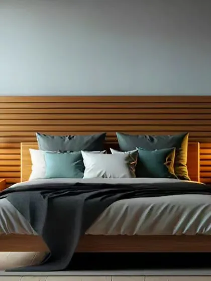 A minimalist bedroom design featuring a slatted wood headboard that extends across the wall. The simple wooden bed frame and matching nightstands with warm pendant lights create a calm, Scandinavian-inspired retreat.