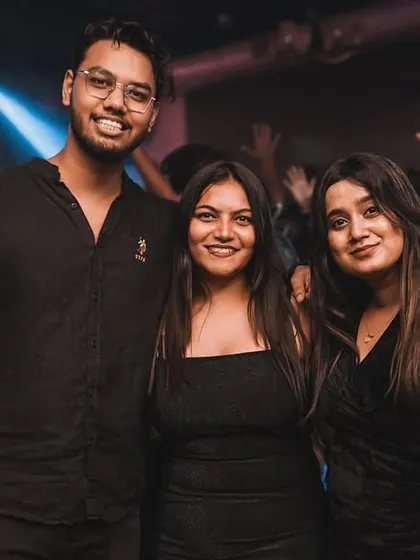 Friends posing for a picture amidst the party. My events are the perfect backdrop for making new memories.