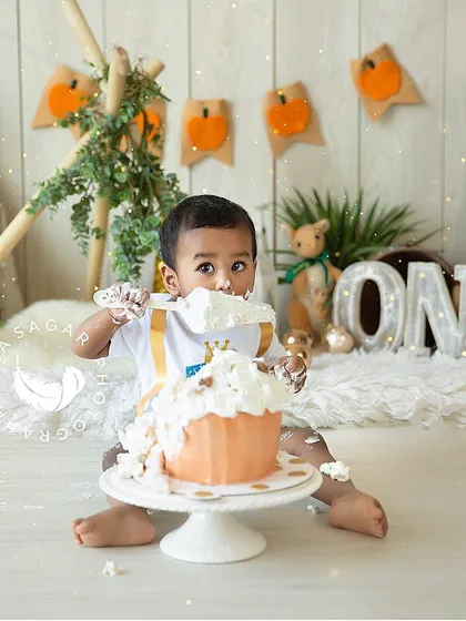 A spoonful of birthday cake is the best way to celebrate turning one. This photo captures the curiosity and joy of the moment.