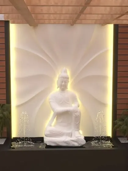A 3D concept for a grand water feature with a white Buddha statue, set against a beautifully carved and backlit panel.