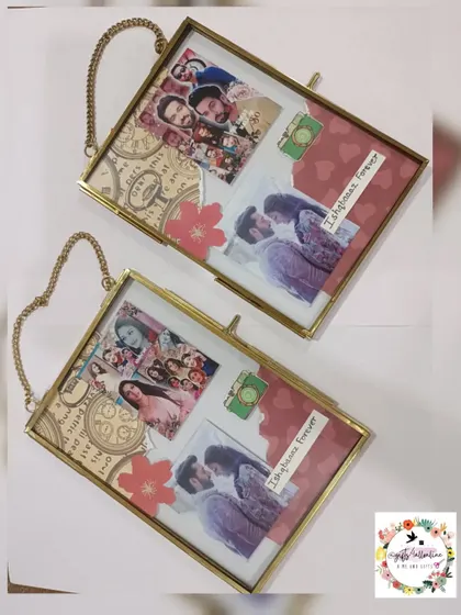 A pair of custom vintage-style hanging glass frames. These frames have a classic, elegant look and are perfect for displaying cherished photos.