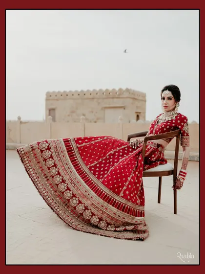 A bride reigning over her kingdom. This powerful portrait of Sonakshi at Suryagarh, Jaisalmer, uses the stark, beautiful landscape to create a sense of modern royalty.