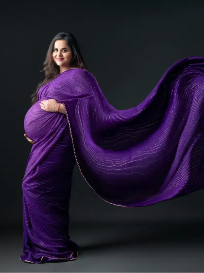 The magic of flowing fabric. We love creating dynamic shots like this, where the purple saree seems to dance in the air.