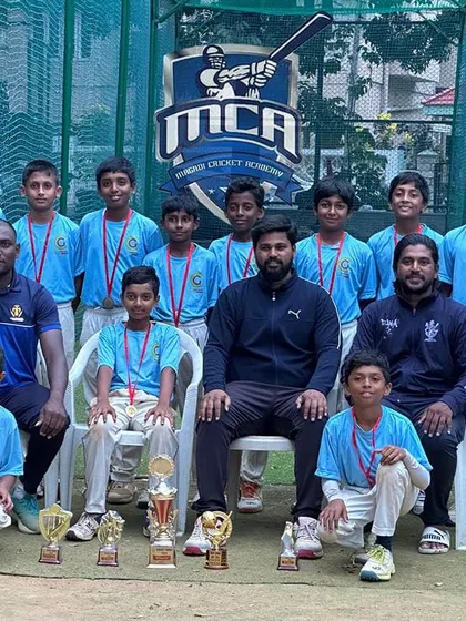 Champions of the Cricket Habba Tournament U-12. The team celebrates with their medals and the winner's trophy after a splendid victory in the finals.