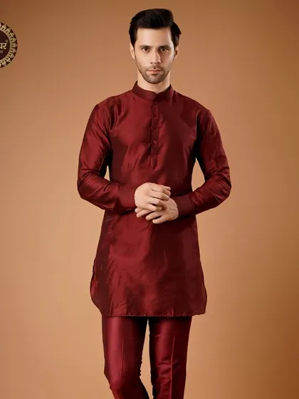 A deep maroon silk kurta set, offering a rich and royal look that is both simple and powerful.