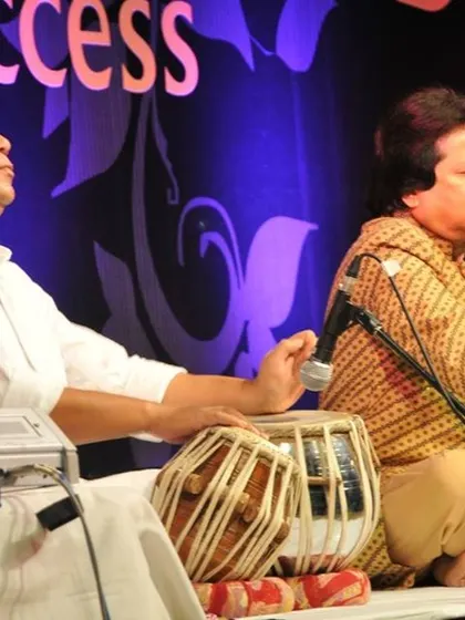 An Indian classical music performance, known as a ghazal night, arranged for a corporate client's special event. This type of entertainment provides a sophisticated and culturally rich experience for guests.