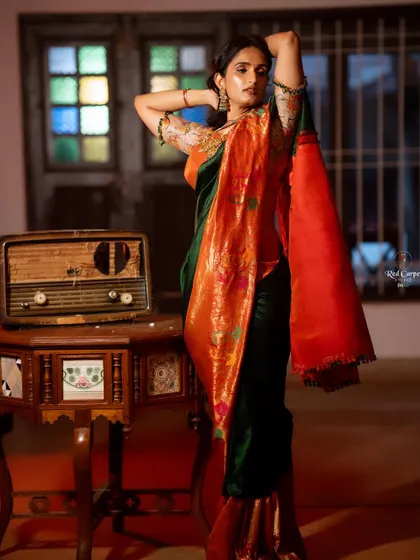A vintage-inspired shot of Kaavya Shastry. The rich colors of the saree stand out beautifully in this artistic composition.