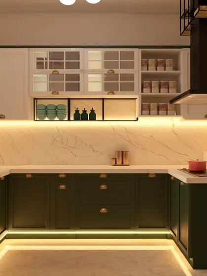 This U-shaped kitchen combines olive green base cabinets with white upper cabinets for a fresh, contemporary look. The design includes glass-fronted display sections and is illuminated by warm under-cabinet and kickboard lighting.