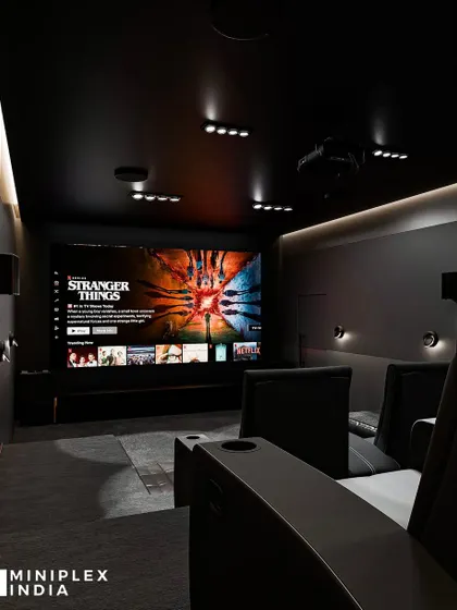 Here you can see the 'Shadow Luxe' theater in action. The dark, non-reflective surfaces ensure the 4K screen's colors and brightness pop, creating a vivid and distracting-free visual experience.