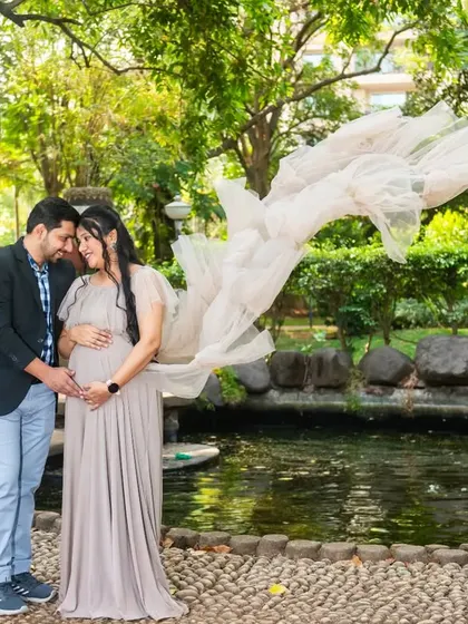 The gentle breeze catching the trail of this beautiful beige gown creates a dreamy, ethereal effect. This is a perfect example of how I use movement to add magic to maternity photos.