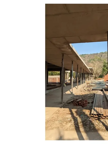 The raw concrete frame of the Alibaug family commune, with the hillscape visible in the background. The space between the structures is what the project is about, creating an atmosphere of country life.