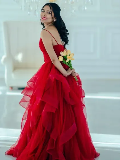 Another angle of the red tiered ballgown, showing how beautifully it moves and photographs. It's a favorite for pre-wedding shoots and engagement parties.