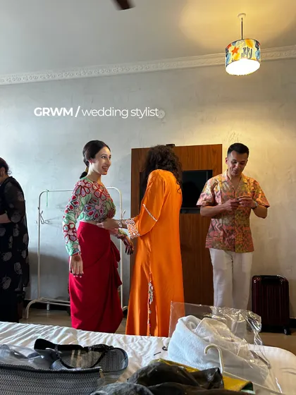 A "Get Ready With Me" moment with the wedding stylist. This is the on-site drama and joy of getting the first shots of "the look".