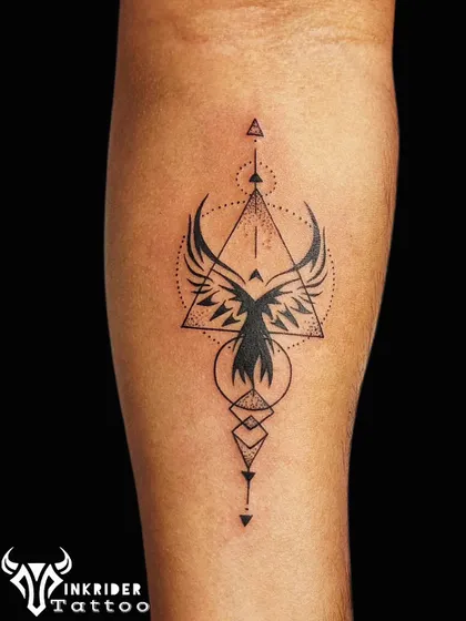 A geometric phoenix tattoo, symbolizing rebirth and resilience. The design combines the mythical bird with triangles and circles for a modern, sacred geometry feel.