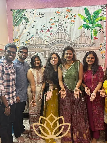 A final group photo from Rashmi's mehendi event, capturing all the happy faces and beautiful henna art.