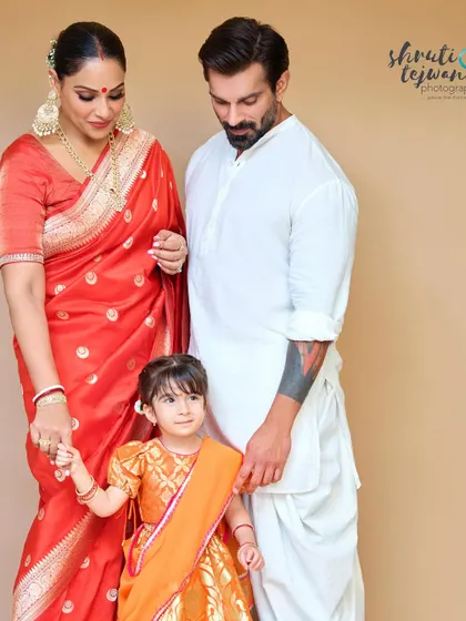 A beautiful family trio. This photo captures the loving gaze between parents and child, a perfect example of the heartwarming family stories I aim to tell.